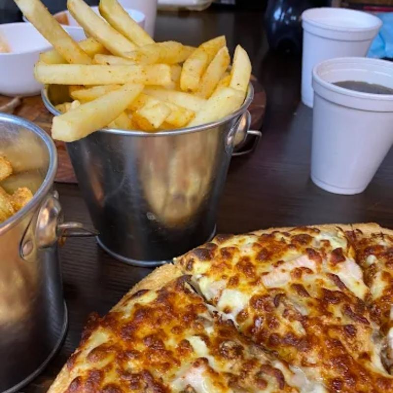 Pizza with a bucket of fries